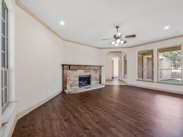 unfurnished living room with dark hardwood / wood-style flooring, a fireplace, and crown molding