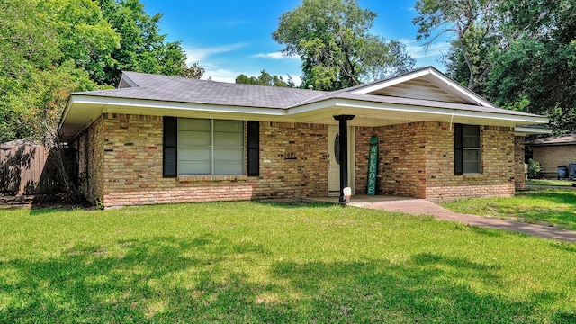 ranch-style house with a front yard