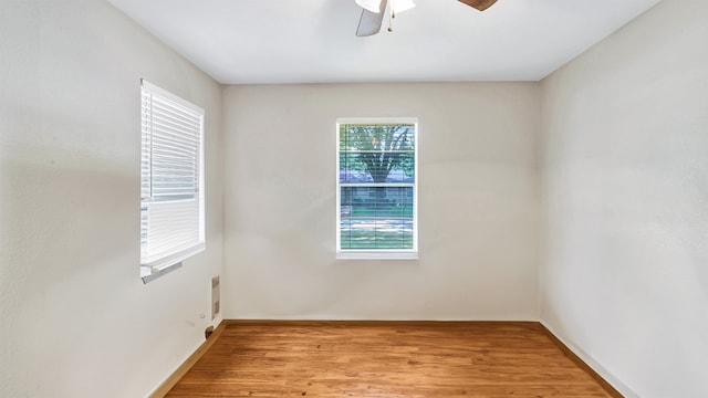 unfurnished room with light wood-type flooring and ceiling fan