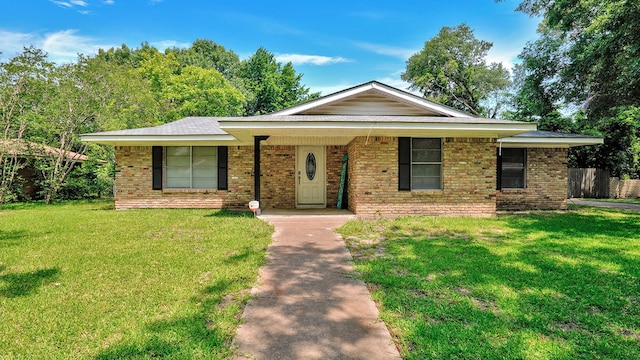 single story home with a front yard and a porch