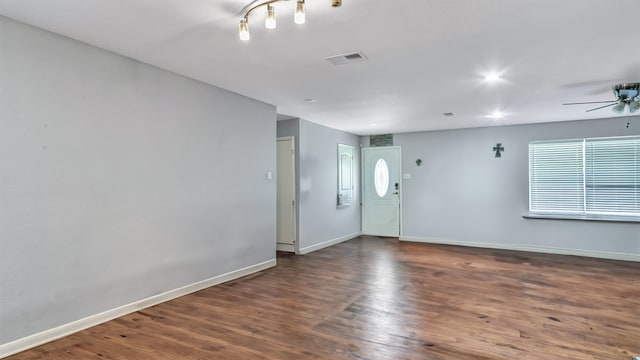 foyer entrance with dark hardwood / wood-style flooring and ceiling fan