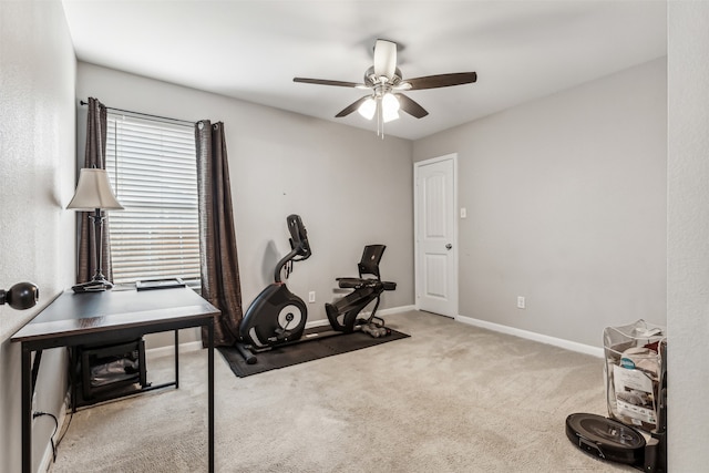 workout room with light carpet and ceiling fan