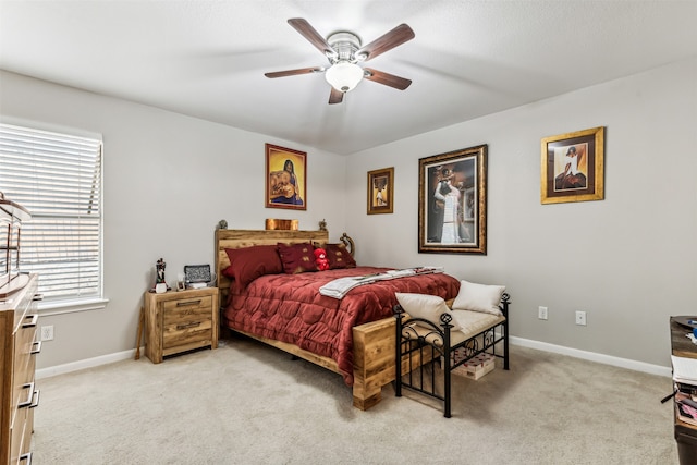 bedroom featuring light carpet and ceiling fan