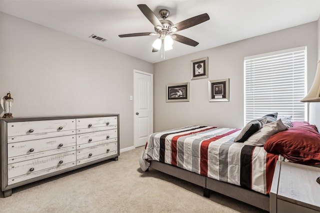 carpeted bedroom with ceiling fan