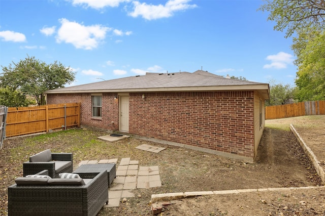 back of house with a patio