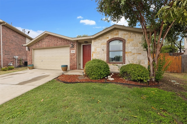 single story home featuring a garage and a front yard