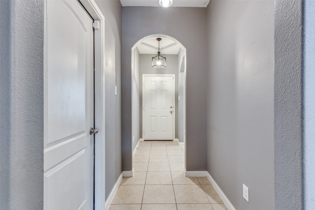 hallway with light tile patterned floors