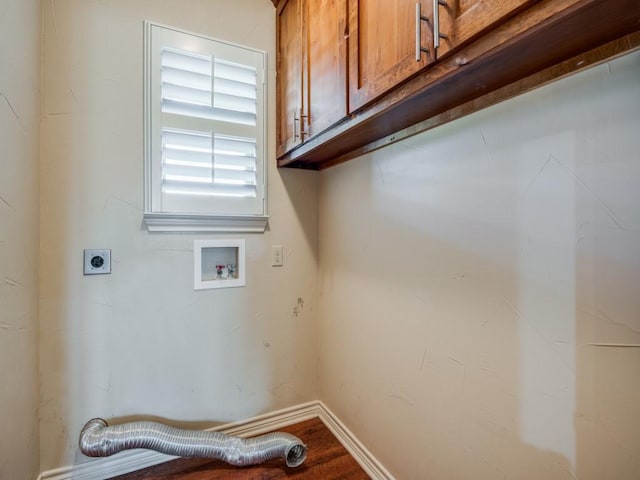 laundry room featuring cabinets, hookup for a washing machine, hookup for an electric dryer, and hardwood / wood-style flooring