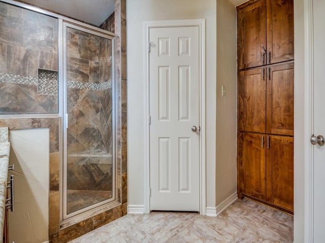 bathroom with an enclosed shower