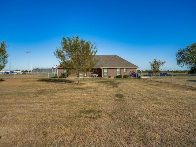 view of yard with a rural view