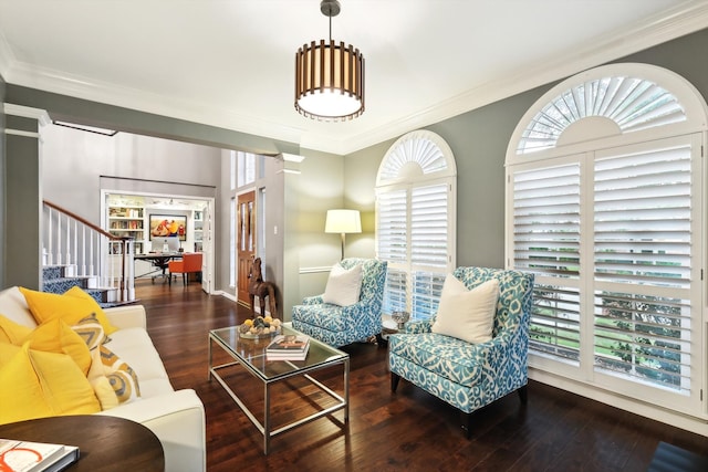 living room featuring dark wood-type flooring and crown molding