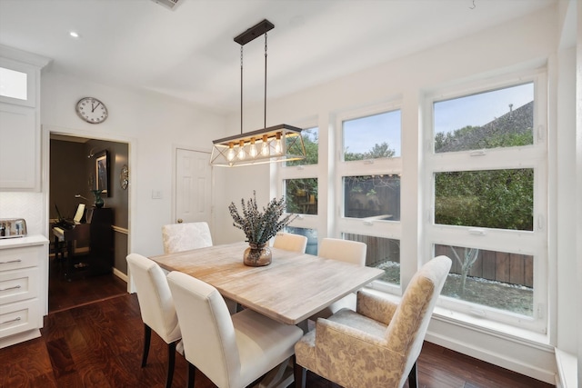 dining space with dark wood-type flooring