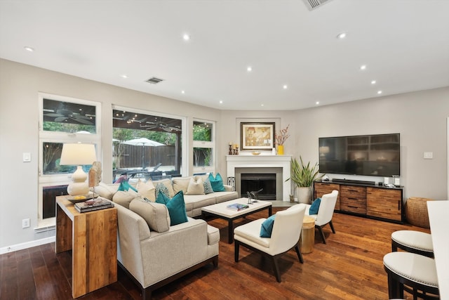 living room featuring dark wood-type flooring