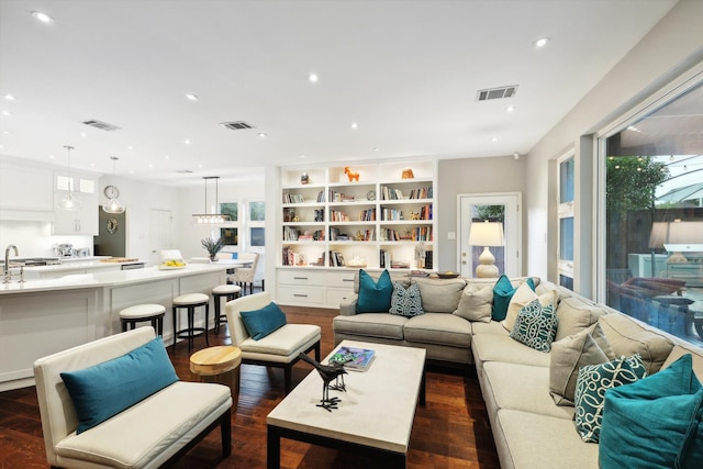 living room with dark hardwood / wood-style flooring