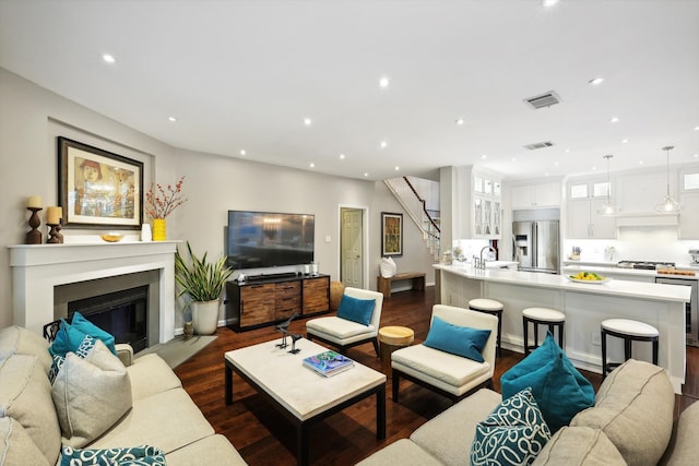 living room featuring dark hardwood / wood-style floors