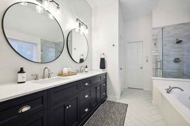 bathroom featuring tile patterned flooring, vanity, and plus walk in shower