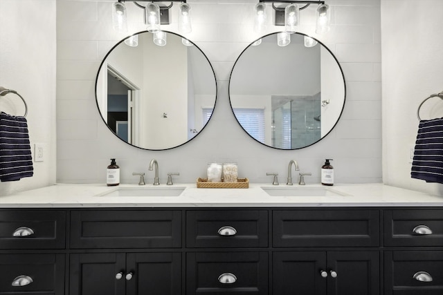 bathroom featuring walk in shower, tasteful backsplash, and vanity