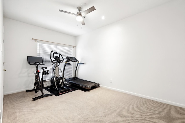 exercise area with ceiling fan and carpet floors