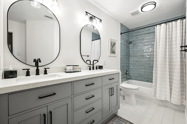 full bathroom with toilet, shower / bath combo, vanity, and tile patterned flooring