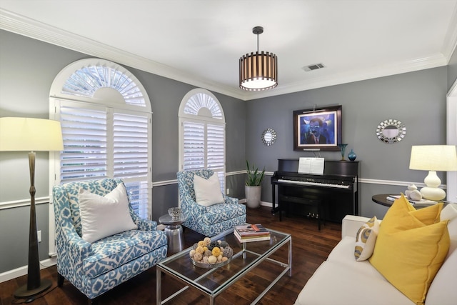 living room featuring dark wood-type flooring and crown molding