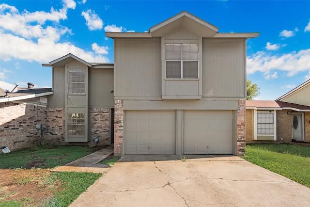 view of front of property featuring a garage and a front yard