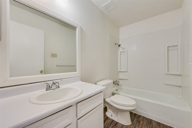 full bathroom with toilet, shower / tub combination, vanity, and hardwood / wood-style floors