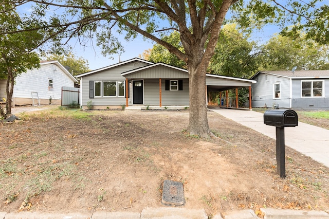 view of front of home featuring a carport