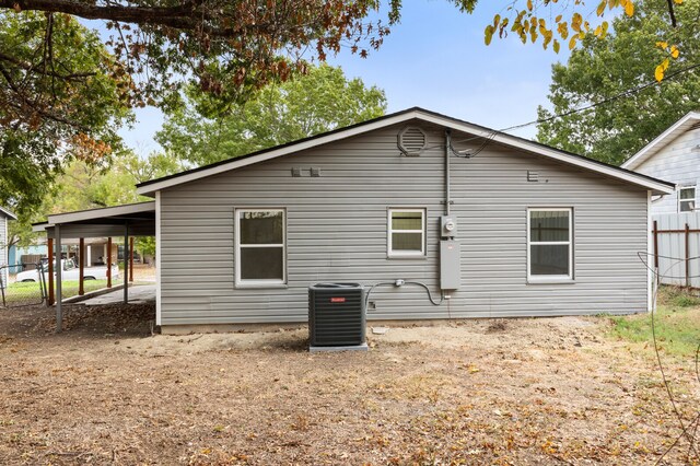 view of side of home featuring cooling unit