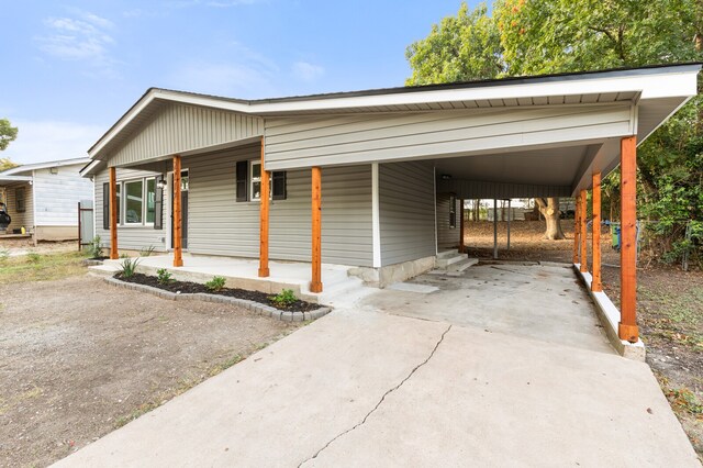 view of front of property with a carport