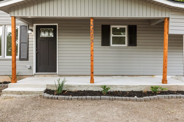 property entrance with covered porch