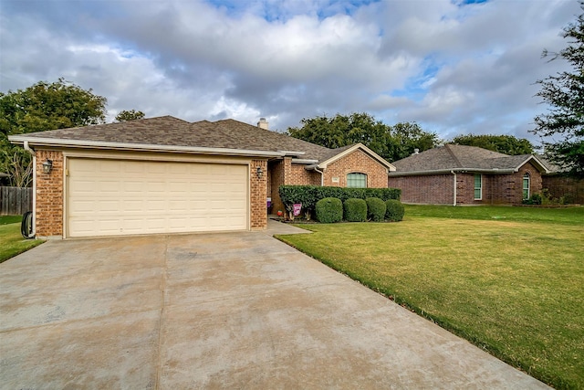 ranch-style house with a garage and a front lawn