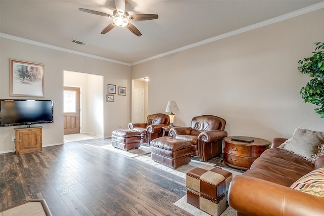 living room with hardwood / wood-style flooring, crown molding, and ceiling fan