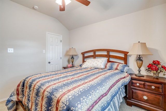 carpeted bedroom featuring lofted ceiling and ceiling fan