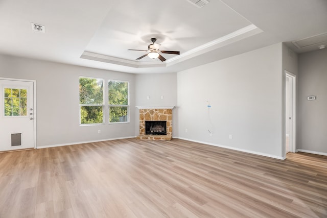 unfurnished living room with light wood-type flooring and plenty of natural light