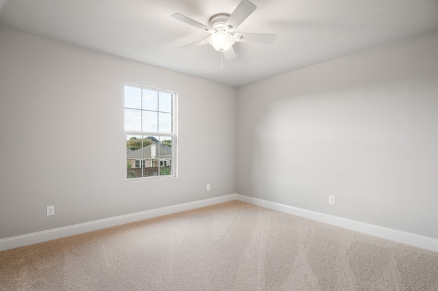 unfurnished room with carpet flooring and ceiling fan