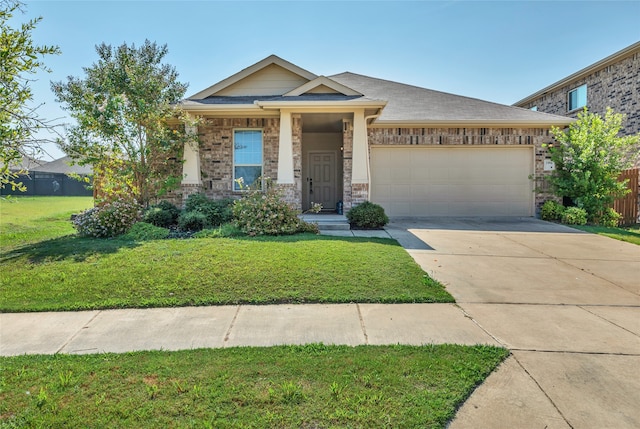 view of front of home with a garage and a front yard