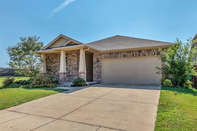 view of front of house featuring a garage and a front yard