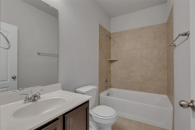 full bathroom with toilet, vanity, tiled shower / bath, and tile patterned flooring