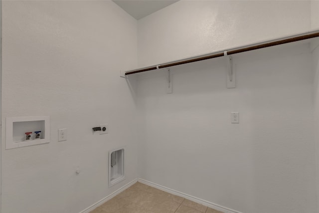 laundry room featuring light tile patterned flooring, hookup for a gas dryer, hookup for a washing machine, and hookup for an electric dryer