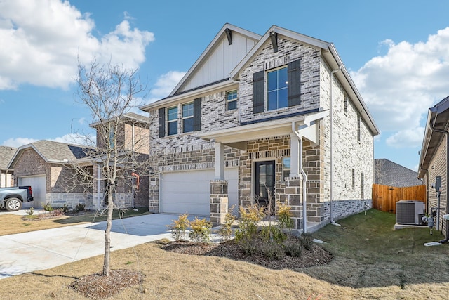 craftsman house featuring a garage, a front yard, and central AC