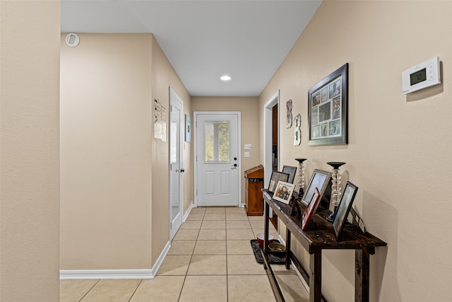 entryway with light tile patterned floors