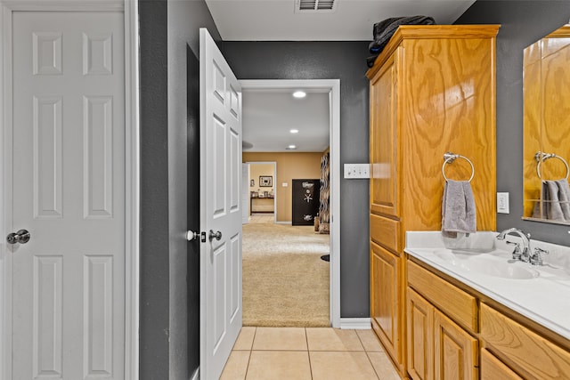 bathroom with tile patterned flooring and vanity