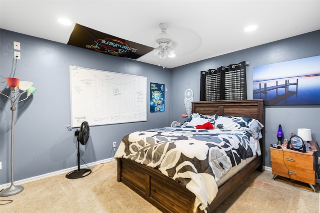 bedroom with ceiling fan and light colored carpet