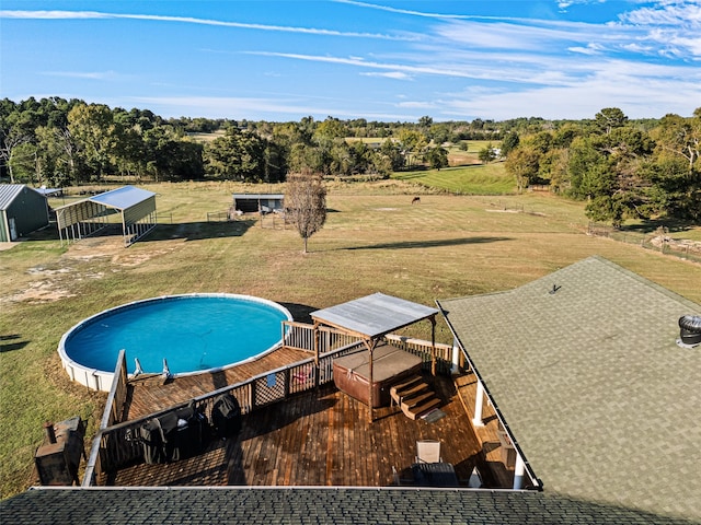 view of pool with a patio and a yard