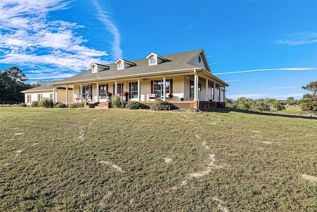 country-style home with a front lawn and covered porch