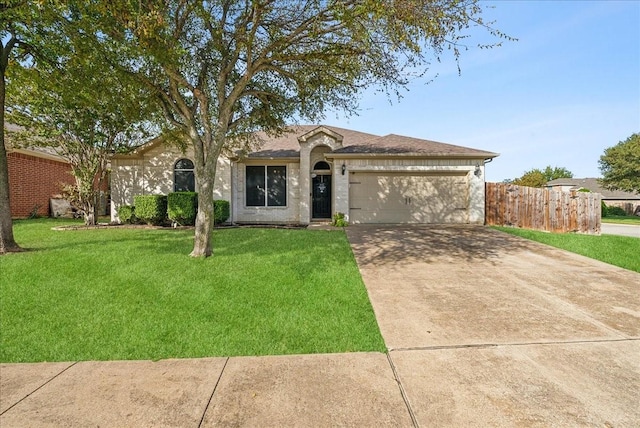 single story home with a garage and a front lawn