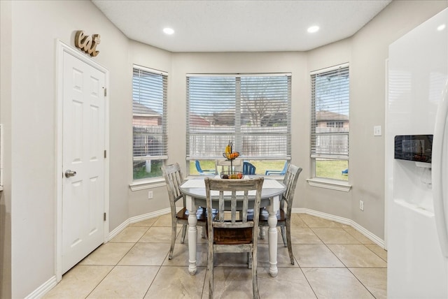 dining space with light tile patterned floors