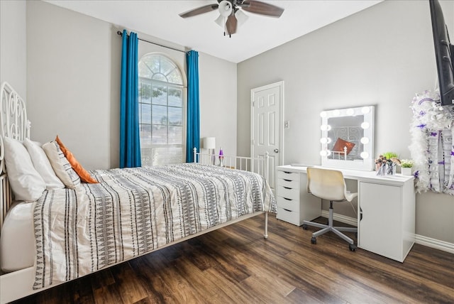 bedroom featuring ceiling fan and dark hardwood / wood-style floors