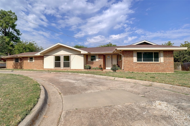 ranch-style house with a front yard