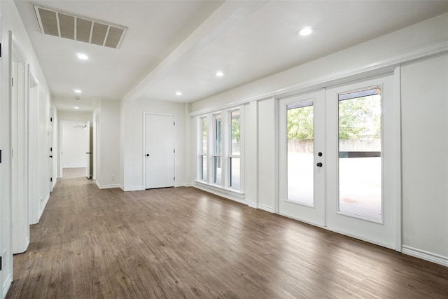 interior space with dark hardwood / wood-style floors and french doors